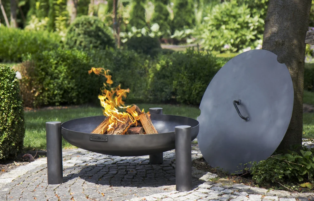 COOK KING fire bowl with its lid on a lawn